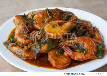 Delicious Kam Heong Prawns on white plate. Delicious Asian food concept 113322416