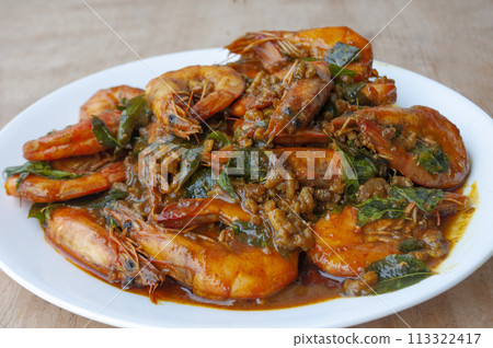 Kam Heong Prawns on white plate. Delicious Asian food concept Kam Heong Prawns on white plate. Delicious Asian food concept 113322417