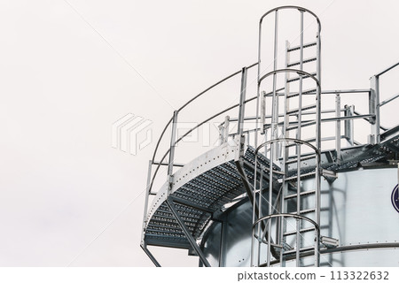 Industrial metal ladder with round protection, railing Industrial metal ladder with round protection, railing 113322632