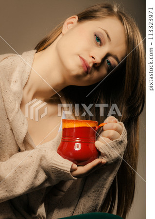 Beverage. Girl holding cup mug of hot drink tea or coffee 113323971