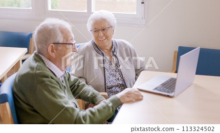 Senior people smiling during video call from a nursing home 113324502