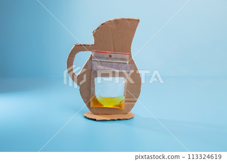 Plastic bag attached to cardboard cutout, pitcher craft concept 113324619