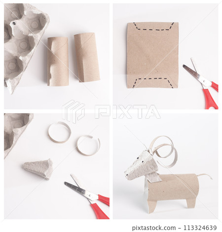 Simple surface displays a creative ram with curled horns crafted from a recycled toilet paper roll, an easy and educational animal-themed project 113324639