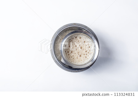 South Indian Filter coffee served on a white background South Indian Filter coffee served on a white background 113324831