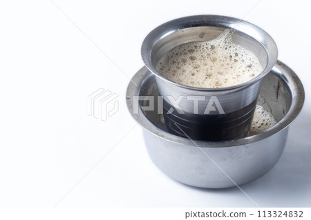 South Indian Filter coffee served on a white background. Closeup 113324832