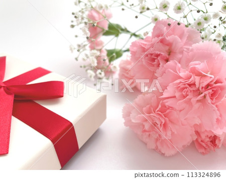 Pink carnations and gifts 113324896