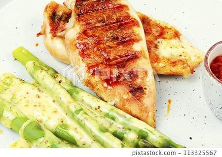 Grilled chicken fillet with asparagus ,macro. 113325567
