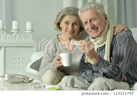 Portrait of elderly man and woman with flu.  113325747