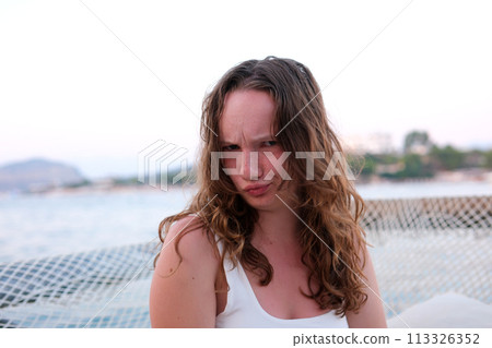 Her face is a portrait of dissatisfaction and boredom she's fed up and it shows. High quality photo 113326352
