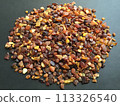 Many amber grains on a black background 113326540