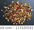 Many amber grains on a black background 113326541