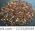 Many amber grains on a black background 113326544