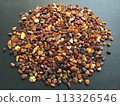 Many amber grains on a black background 113326546