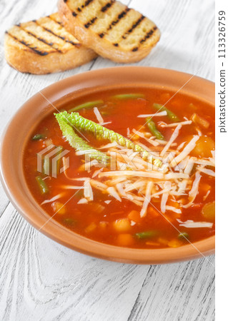 Portion of Minestrone soup 113326759