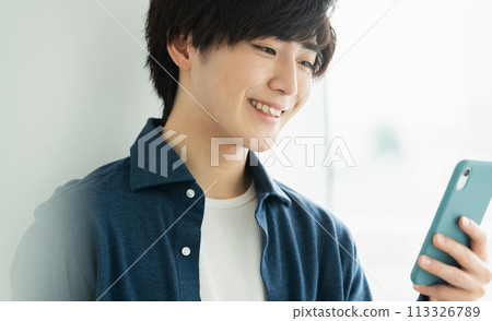 A man with a smartphone A man with a smartphone 113326789