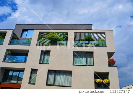 Modern architecture. Urban terrace with flowers and greenery. Urban house Modern architecture. Urban terrace with flowers and greenery. Urban house 113327547