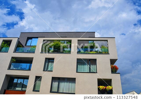 Modern architecture. Urban terrace with flowers and greenery. Urban house Modern architecture. Urban terrace with flowers and greenery. Urban house 113327548