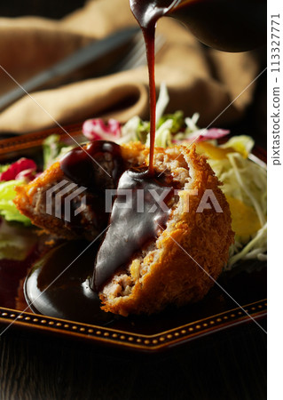 Minced meat cutlet with special sauce 113327771