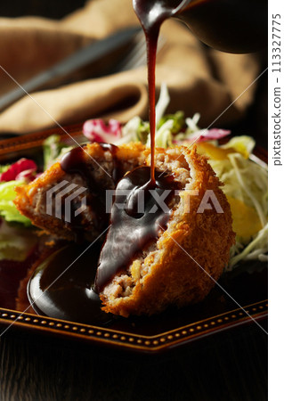 Minced meat cutlet with special sauce 113327775