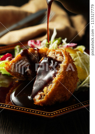 Minced meat cutlet with special sauce 113327779