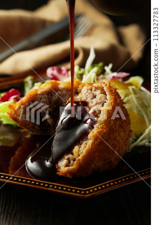 Minced meat cutlet with special sauce 113327783