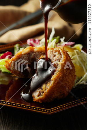 Minced meat cutlet with special sauce 113327810