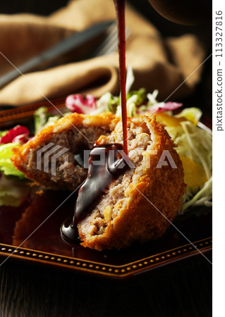 Minced meat cutlet with special sauce 113327816