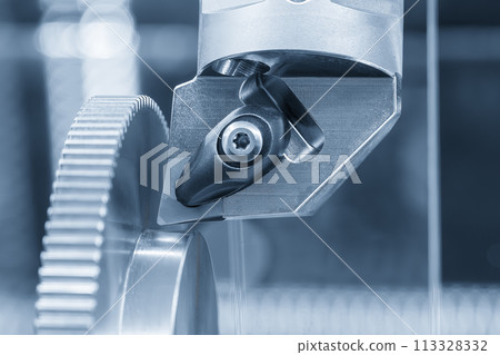 Close up the chip insert on the lathe machine in the light blue scene. Close up the chip insert on the lathe machine in the light blue scene. 113328332