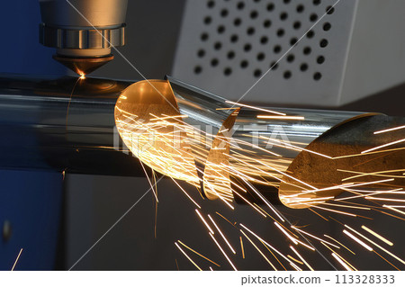 Close up scene the fiber laser cutting machine cut the stainless steel tube and sparkling light. Close up scene the fiber laser cutting machine cut the stainless steel tube and sparkling light. 113328333
