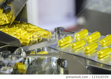 Abstract scene the medicine capsules manufacturing concept. Abstract scene the medicine capsules manufacturing concept. 113328339