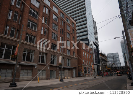 typical New York street with red brick building and skyscrapers 113328890