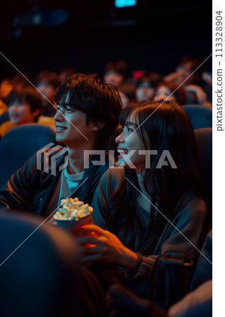 Young couple watching a movie Young couple watching a movie 113328904