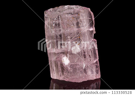 Macro tourmaline mineral stone on black Macro tourmaline mineral stone on black 113330528