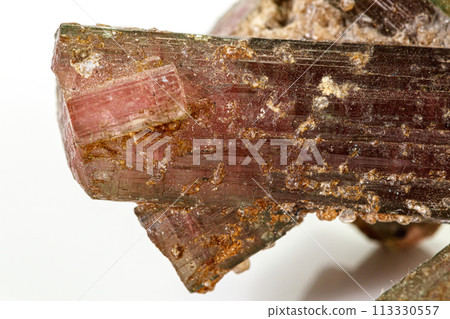 Macro tourmaline mineral stone on white background Macro tourmaline mineral stone on white background 113330557