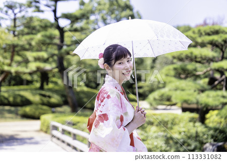 A woman in a yukata A woman in a yukata 113331082