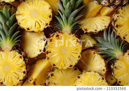 Pineapple slices as a background. Top view. Close up. Pineapple slices as a background. Top view. Close up. 113331568