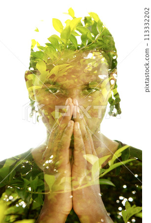 Double exposure portrait of a young man combined with green tree branches photo 113332202
