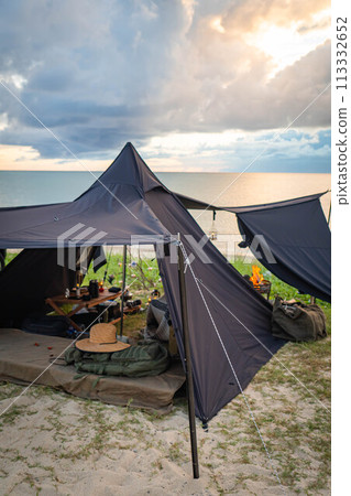 Black tent, one-pole tent, solo camping, sunset, evening sun Black tent, one-pole tent, solo camping, sunset, evening sun 113332652