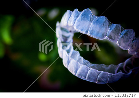 Invisible teeth aligner on light background 113332717