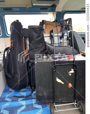 The instruments in the cases are loaded into the van. The instruments in the cases are loaded into the van. 113333415
