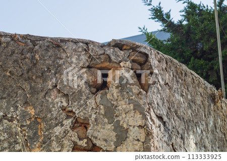 Destruction of wall under influence of natural factors, such as variable humidity, temperature, sunlight, aging and deterioration of structural materials, splitting into individual component parts Destruction of wall under influence of natural factors, such as variable humidity, temperature, sunlight, aging and deterioration of structural materials, splitting into individual component parts 113333925