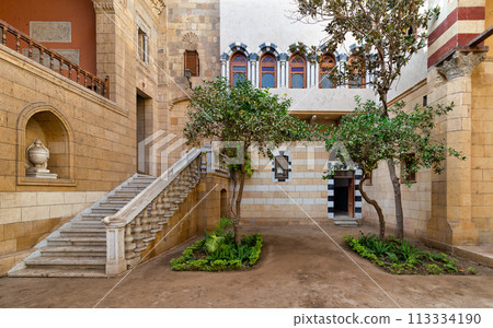 Peaceful sanctuary in Prince Naguib Palace, Cairo, Egypt. Lush greenery, elegant architecture Peaceful sanctuary in Prince Naguib Palace, Cairo, Egypt. Lush greenery, elegant architecture 113334190