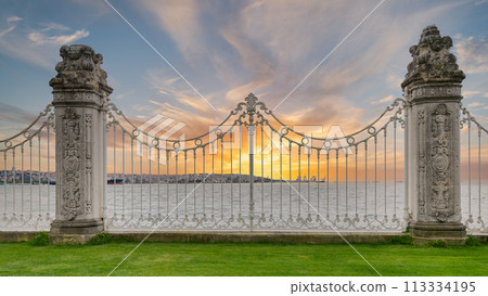 Ornate wrought iron fence decorated with intricate designs overlooking the Bosphorus in Istanbul, Turkey after sunrise Ornate wrought iron fence decorated with intricate designs overlooking the Bosphorus in Istanbul, Turkey after sunrise 113334195