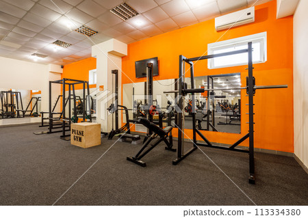 Exercise equipment in an empty gym Exercise equipment in an empty gym 113334380