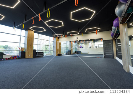 Exercise equipment in an empty gym Exercise equipment in an empty gym 113334384
