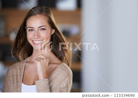 Happy, smile and portrait of woman in home for relaxing, calm and chill on weekend afternoon. House, living room and face of person with joy, confidence and pride on holiday, vacation and free time 113334690