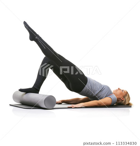 Legs exercise, foam roller and studio woman with bridge workout, balance activity or wellness for gym pilates on floor. Fitness, body training and athlete core muscle development on white background 113334830