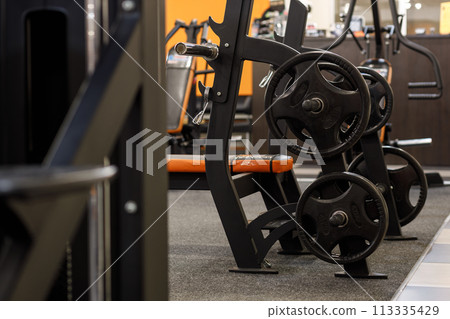 Exercise equipment in an empty gym 113335429