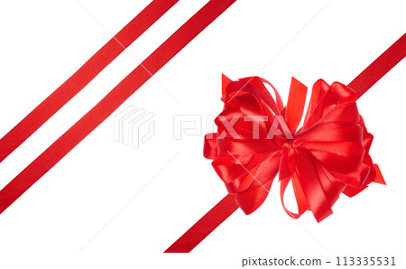 Tied bow made of red silk ribbon on an isolated background, decor for a gift 113335531