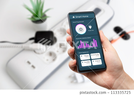 Man using the smart monitoring power strip 113335725